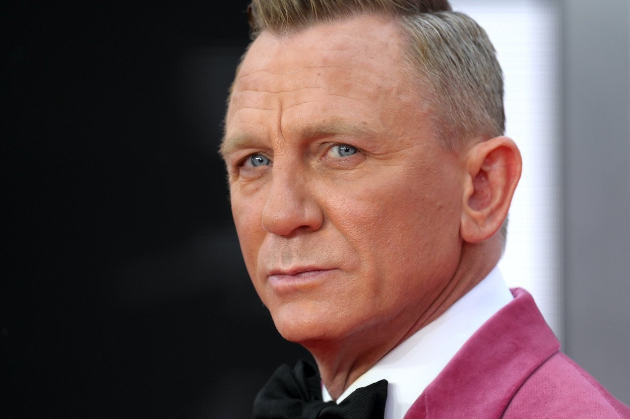 Daniel Craig attends the 'No Time To Die' world premiere. A James Bond author criticized the movie for showing Bond's relationship, which is like calling out Daniel Craig himself.
