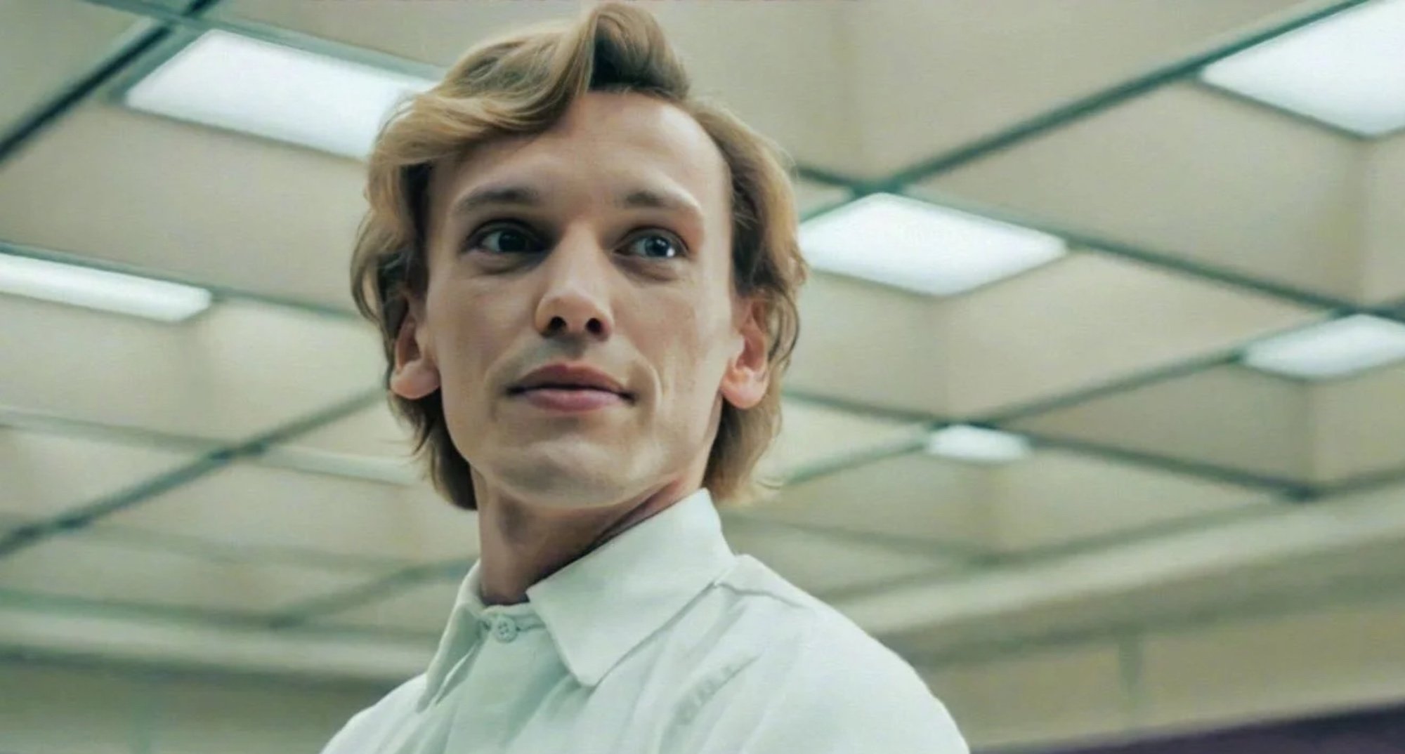 Jamie Campbell Bower as Peter in 'Stranger Things' Season 4 wearing white shirt.