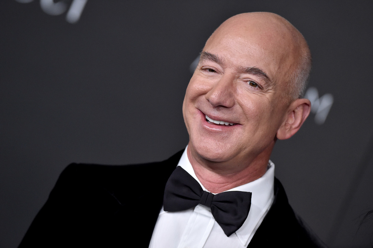 Jeff Bezos smiles and poses at an event.