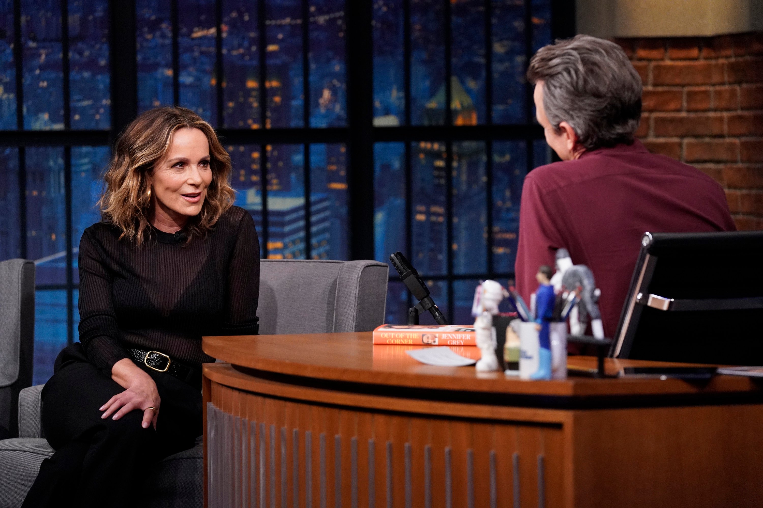 Jennifer Grey talks during an interview with Seth Meyers.