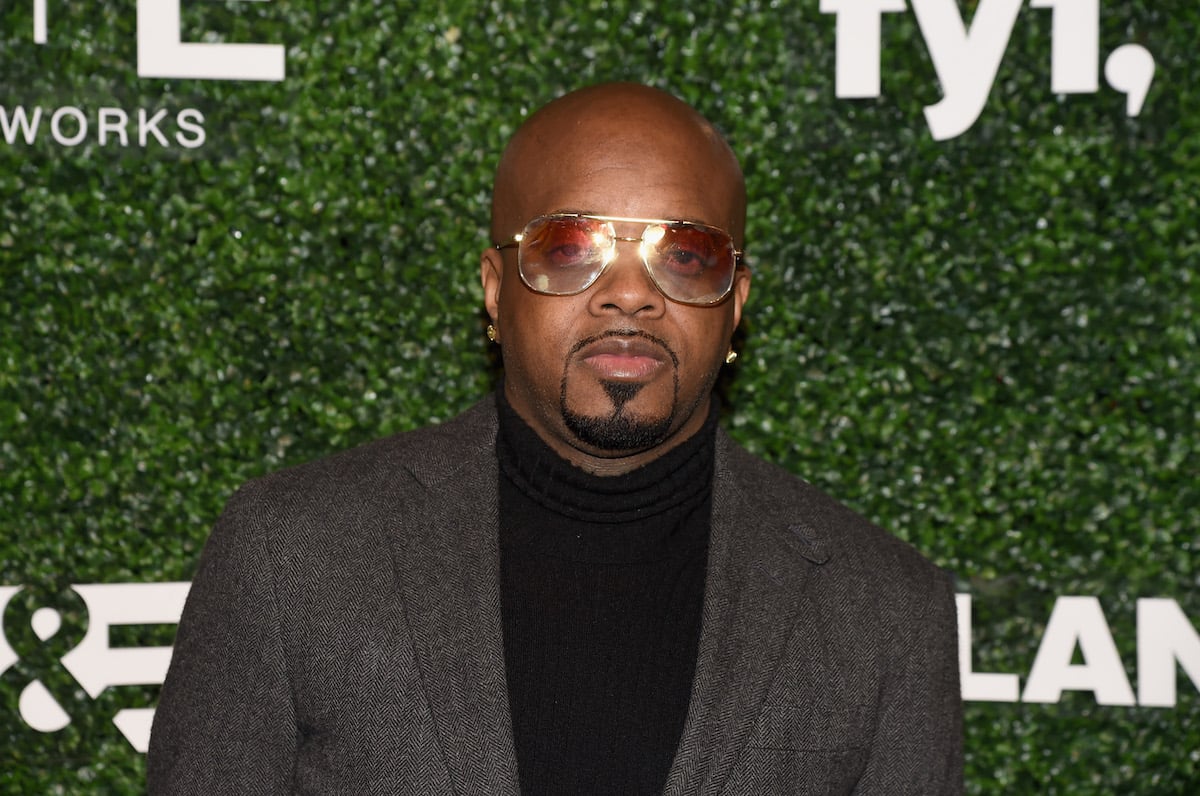 Jermaine Dupri wearing sunglasses and a brown blazer