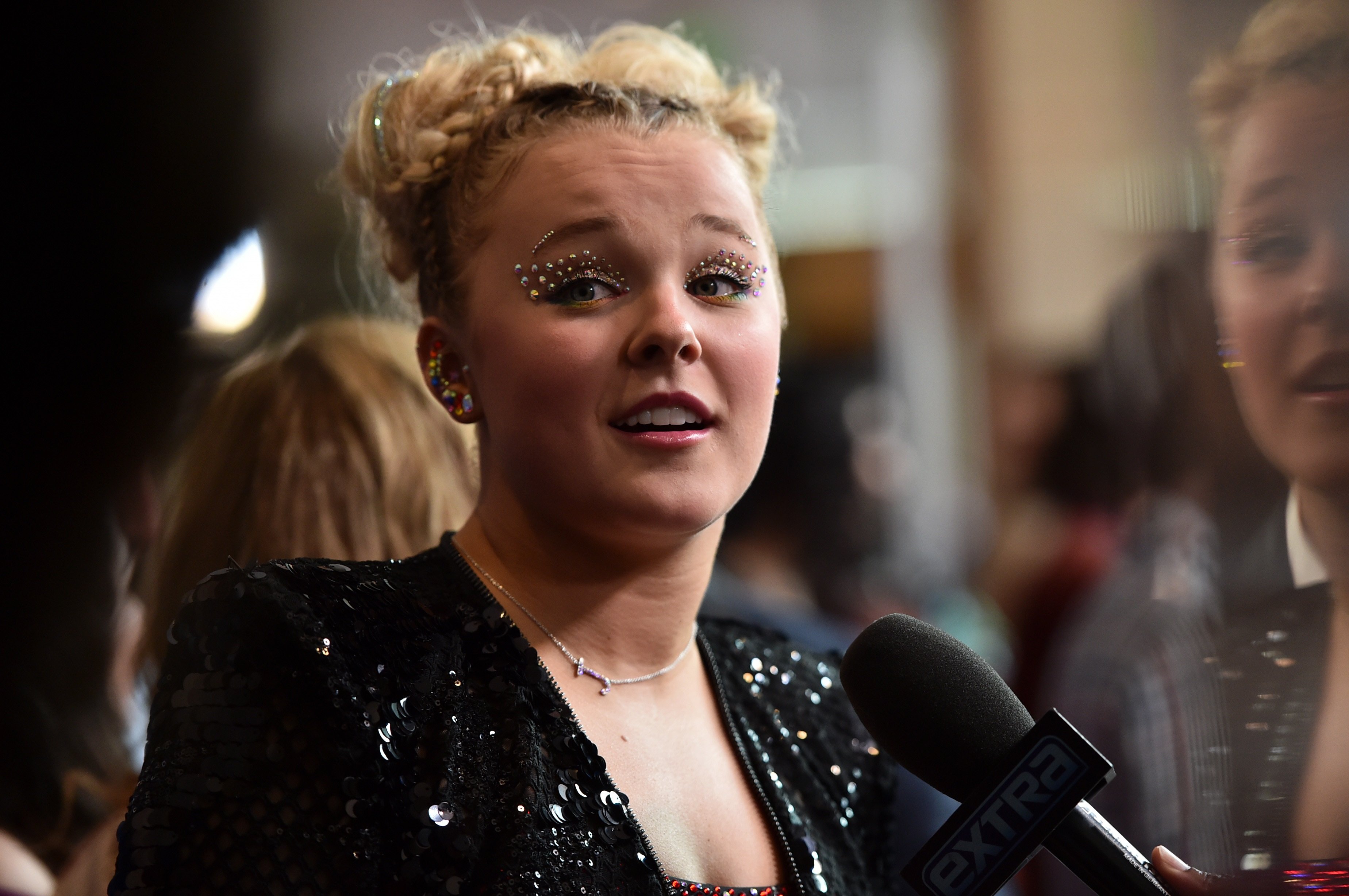 JoJo Siwa, founder of XOMG POP! featured on 'AGT,' looks surprised at the 33rd Annual GLADD media awards