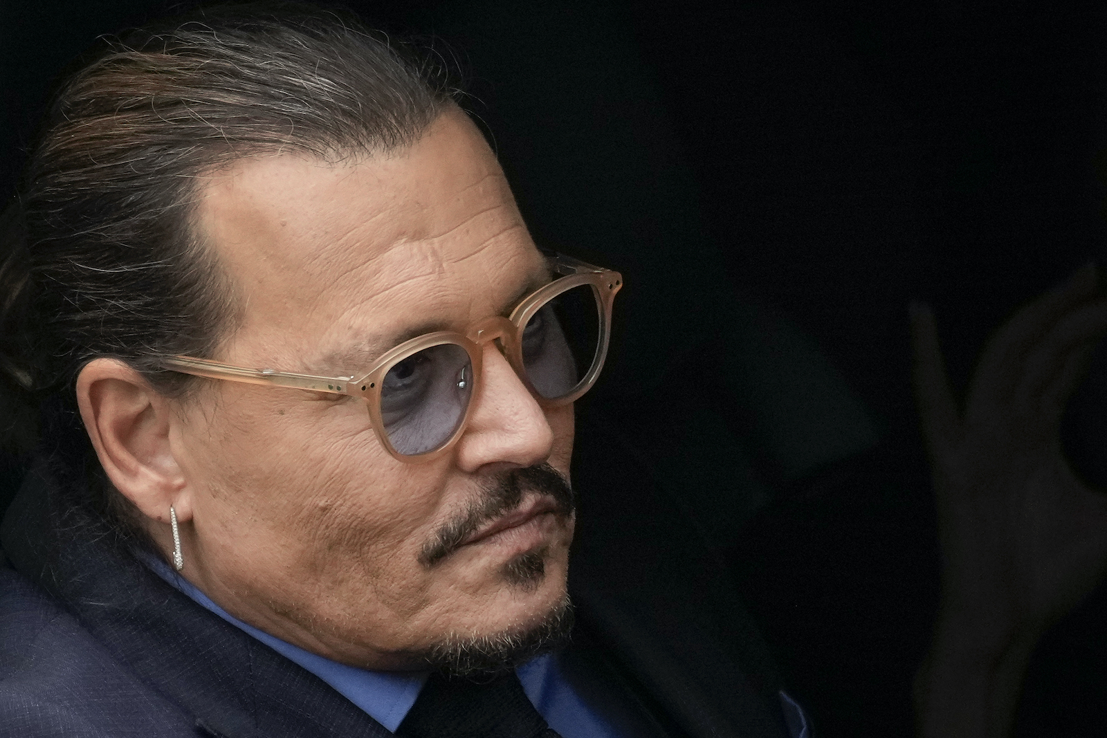 Johnny Depp is photographed in his car leaving the Johnny Depp vs. Amber Heard trial