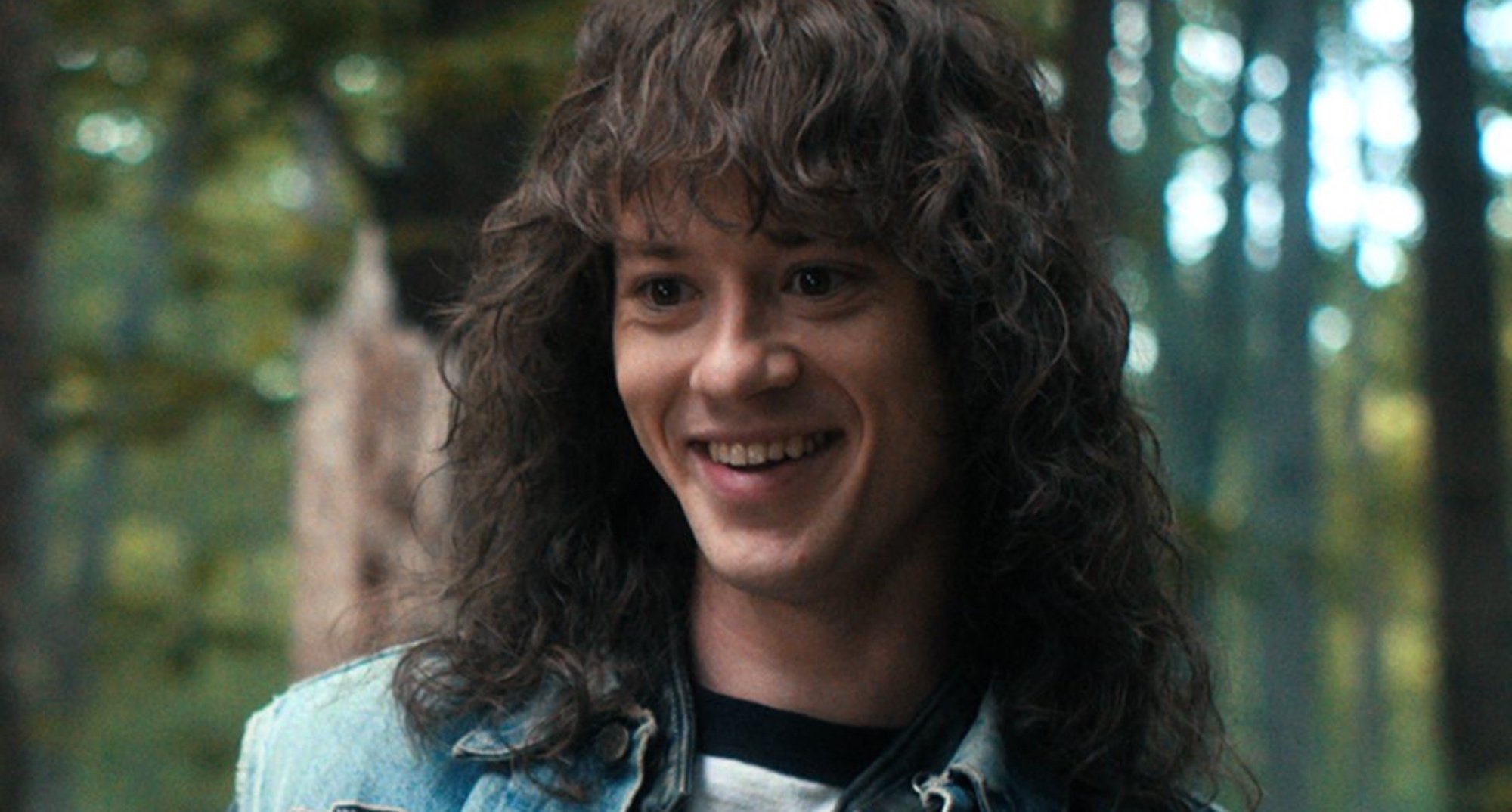 Joseph Quinn as Eddie Munson in 'Stranger Things' Season 4 Volume 1 in the woods.