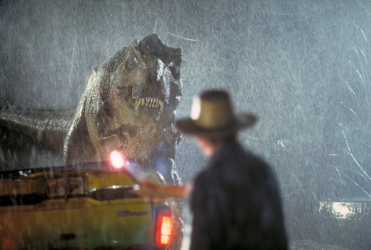 Sam Neill as Dr. Alan Grant stares down a Tyrannosaurus Rex in 'Jurassic Park,' which got a few things wrong with its dinosaurs, including the hunting skills of the T-Rex and the size of the velociraptors.