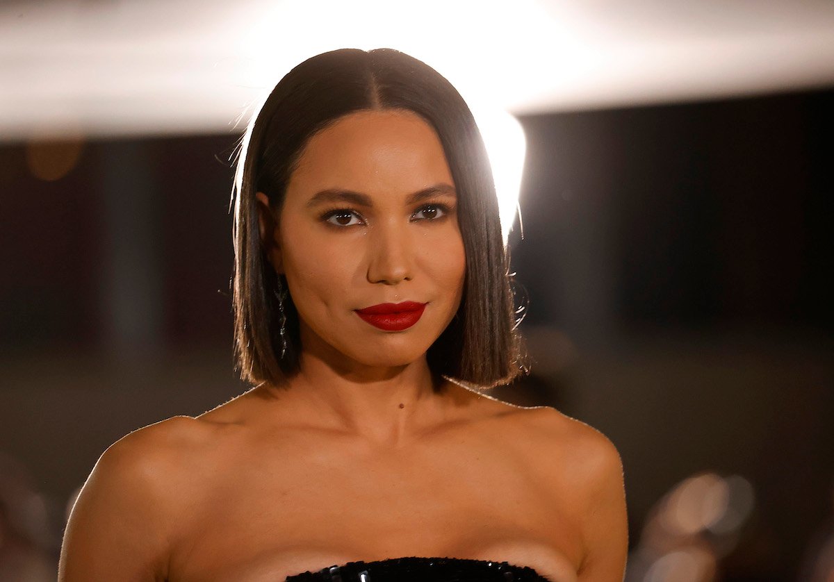Jurnee Smollett attends the 2021 Academy Museum of Motion Pictures Opening Gala in a black dress and red lipstick