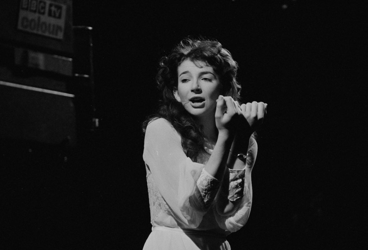 Kate Bush wearing white while performing in 1978.