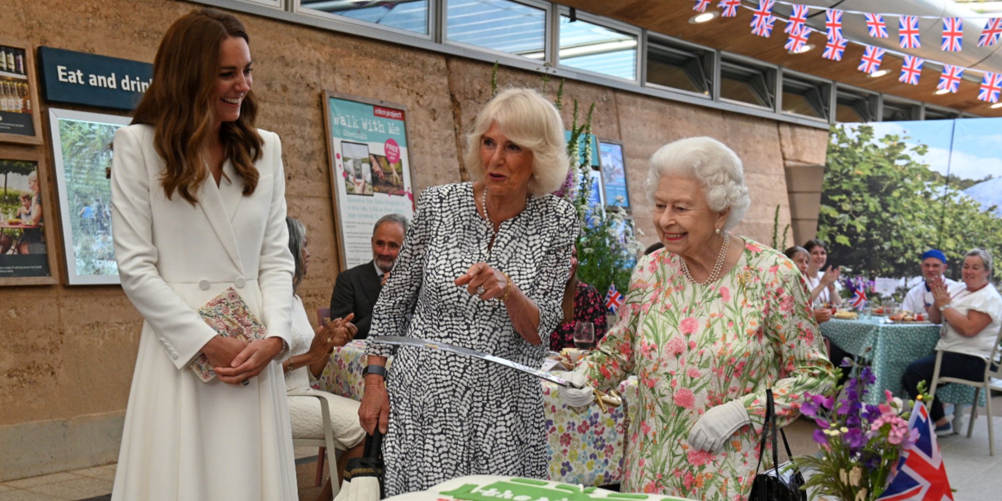 Kate Middleton wears an Alexander McQueen white suit alongside Camilla Parker Bowles and Queen Elizabeth.