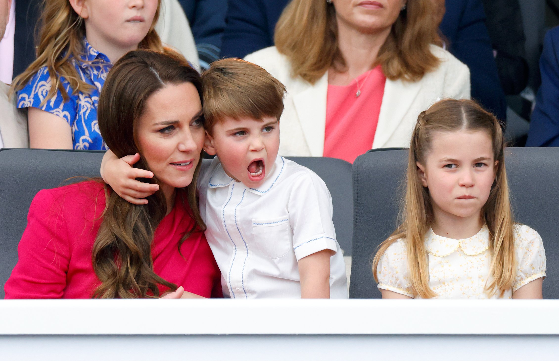Kate Middleton, Prince Louis, and Princess Charlotte who got a little tired of Louis' antics, watching the Platinum Pageant