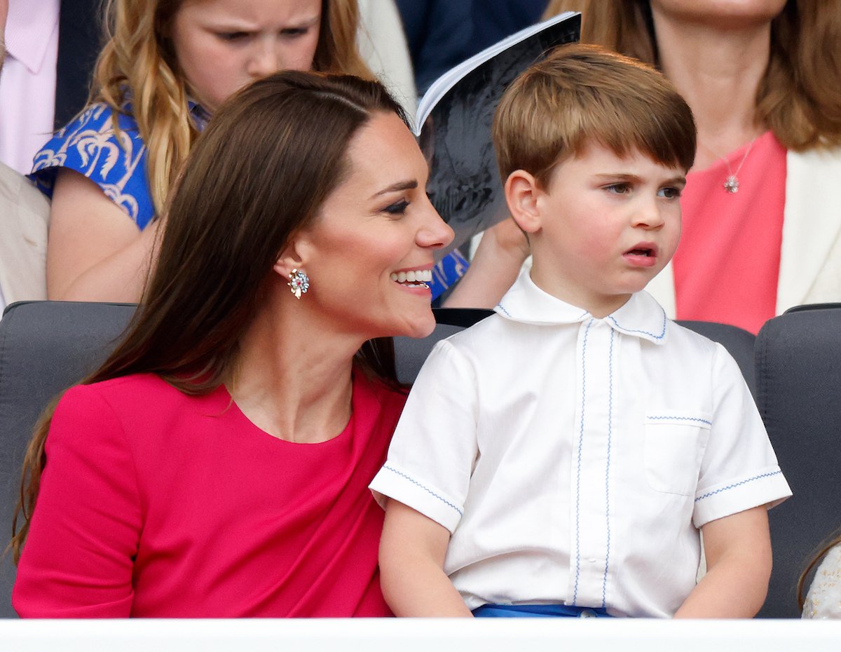 Kate Middleton, who blew a kiss at Prince Louis, smiles at Prince Louis as he looks on