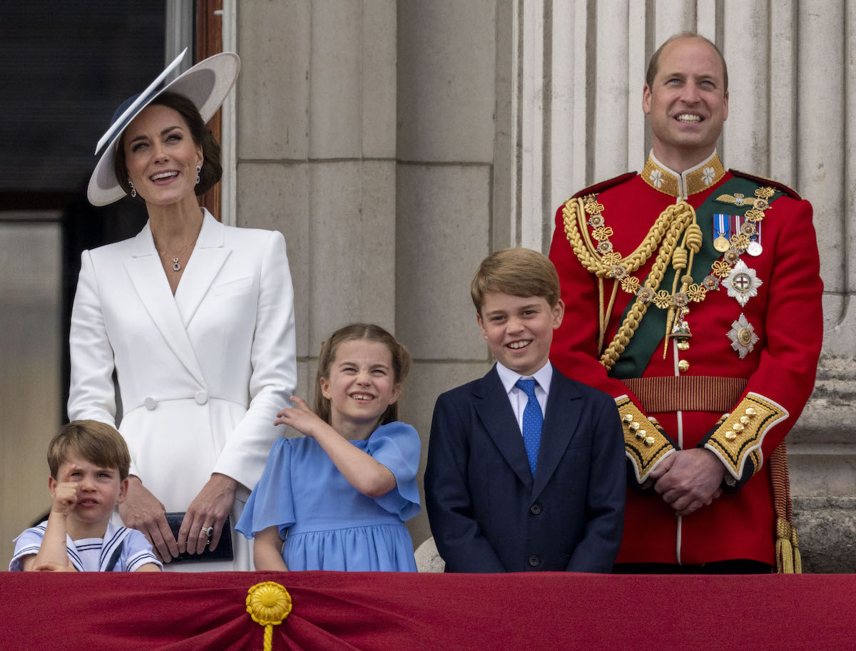 Prince William, who appeared in a Father's Day photo with Prince George, Princess Charlotte, and Prince Louis, stands with Kate Middleton and their children on the Buckingham Palace balcony
