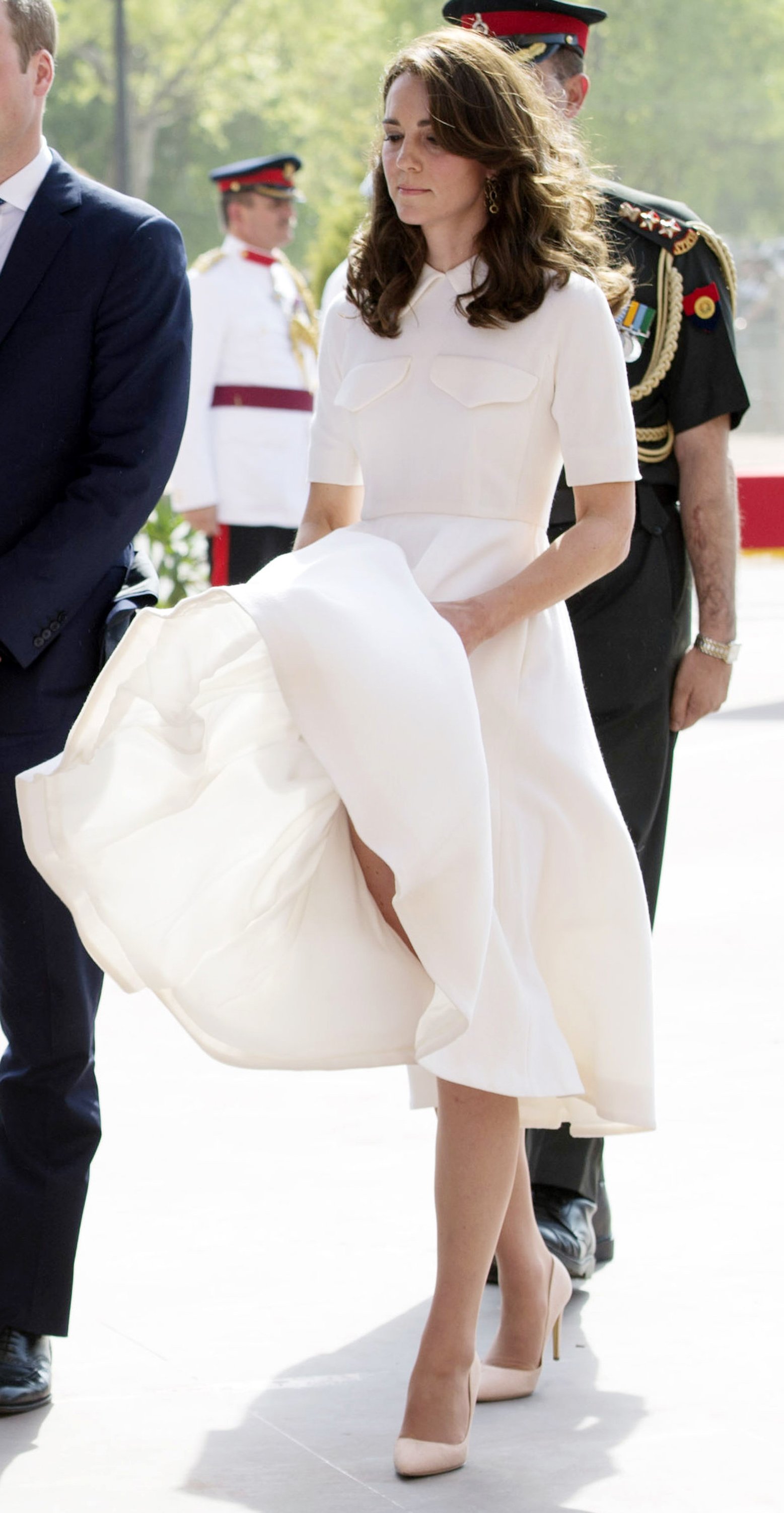 Kate Middleton trying to hold her dress down at the visit India Gate Memorial