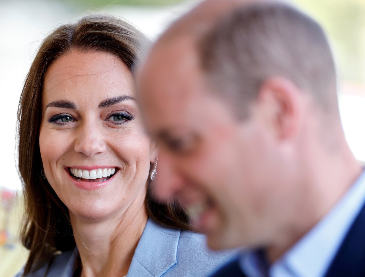 Kate Middleton smiles at Prince William during a museum visit to see their first official joint portrait
