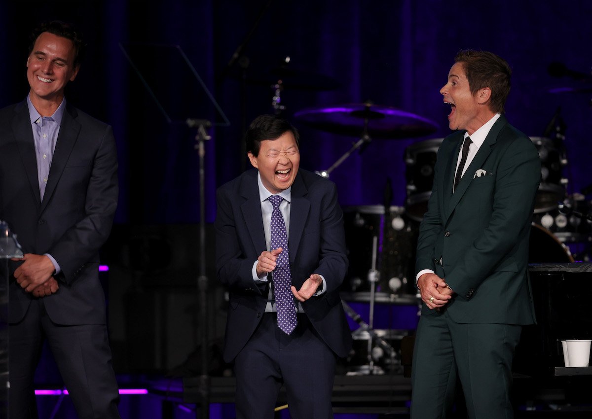President of Alternative Entertainment at Fox Entertainment Rob Wade, Ken Jeong, and Rob Lowe laugh onstage during the 25th anniversary of UCLA Jonsson Cancer Center Foundation's "Taste for a Cure" event