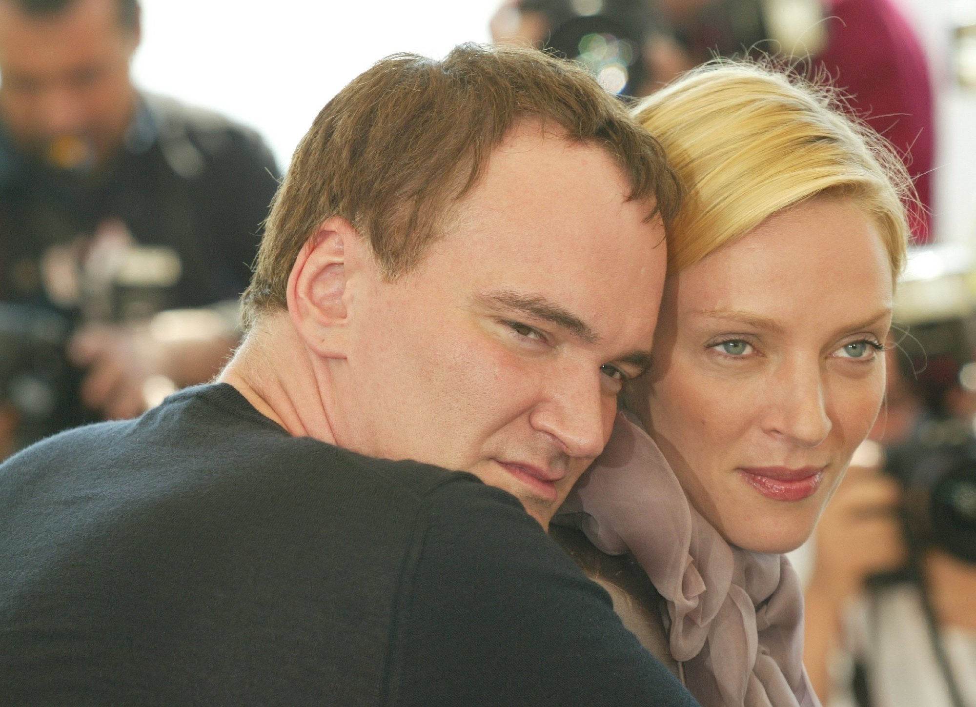 'Kill Bill' filmmaker Quentin Tarantino and actor Uma Thurman hugging each other with a slight smile on their faces