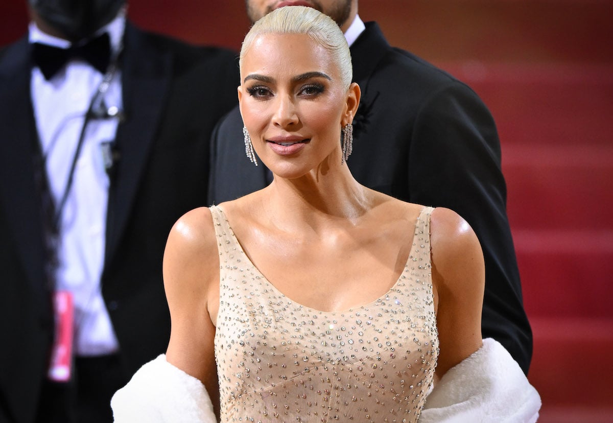 Kim Kardashian smiles and poses at the 2022 Met Gala.