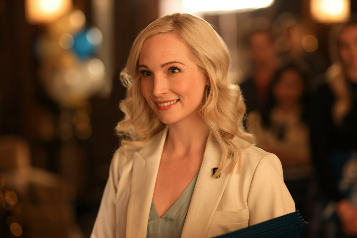 Candice King, in character as Caroline Forbes in the 'Legacies' series finale, wears a white suit jacket over a light blue shirt.
