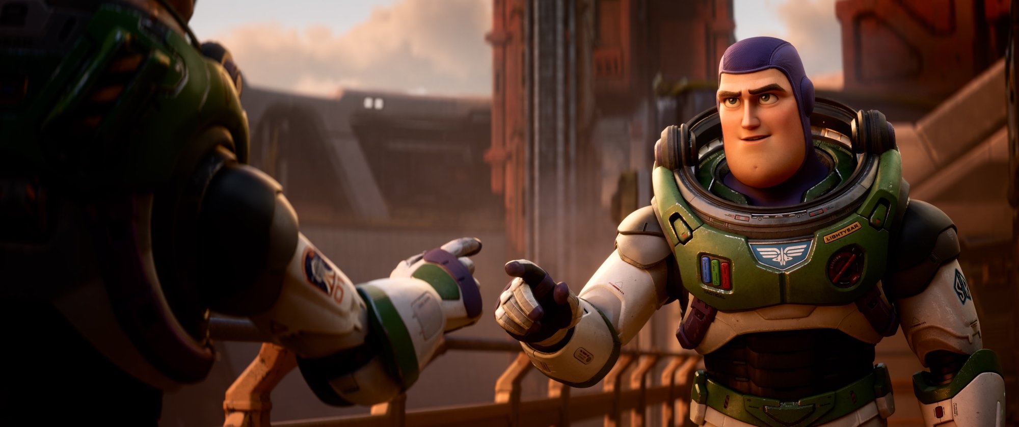 'Lightyear' Buzz Lightyear (Chris Evans) wearing his space ranger uniform and holding out his finger to another space ranger