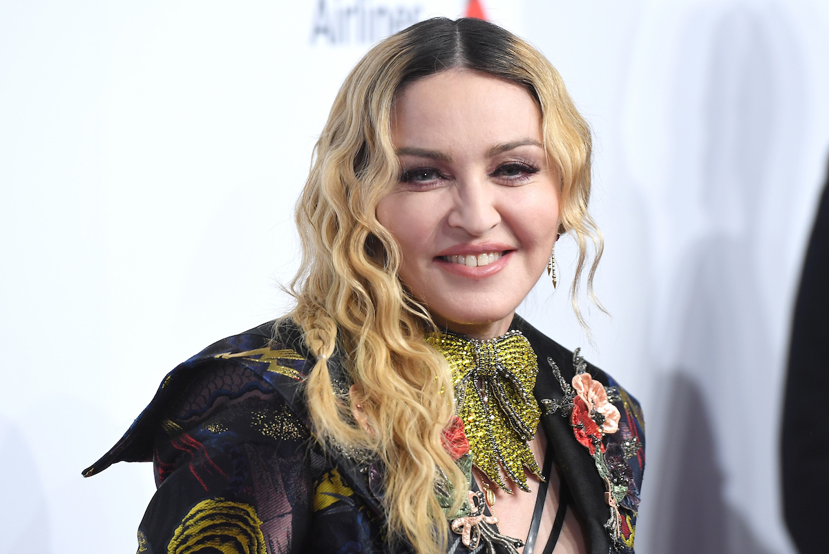 Madonna smiles and poses at an event.