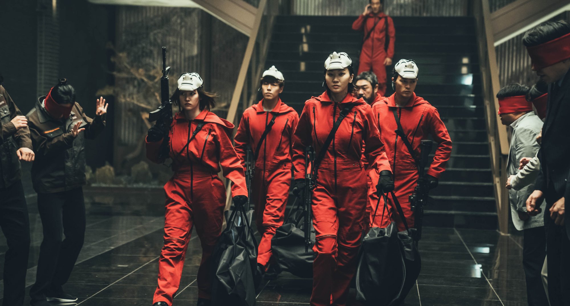 Main characters of 'Money Heist Korea - Joint Economic Area' wearing jumpsuits.