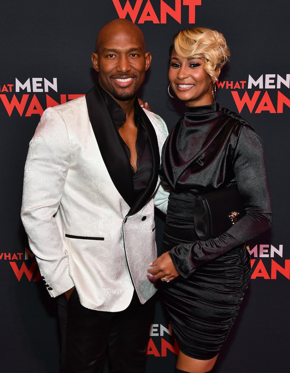 Martell and Melody Holt pose on the red carpet; Martell admits to regrets about the way he cheated in his marriage
