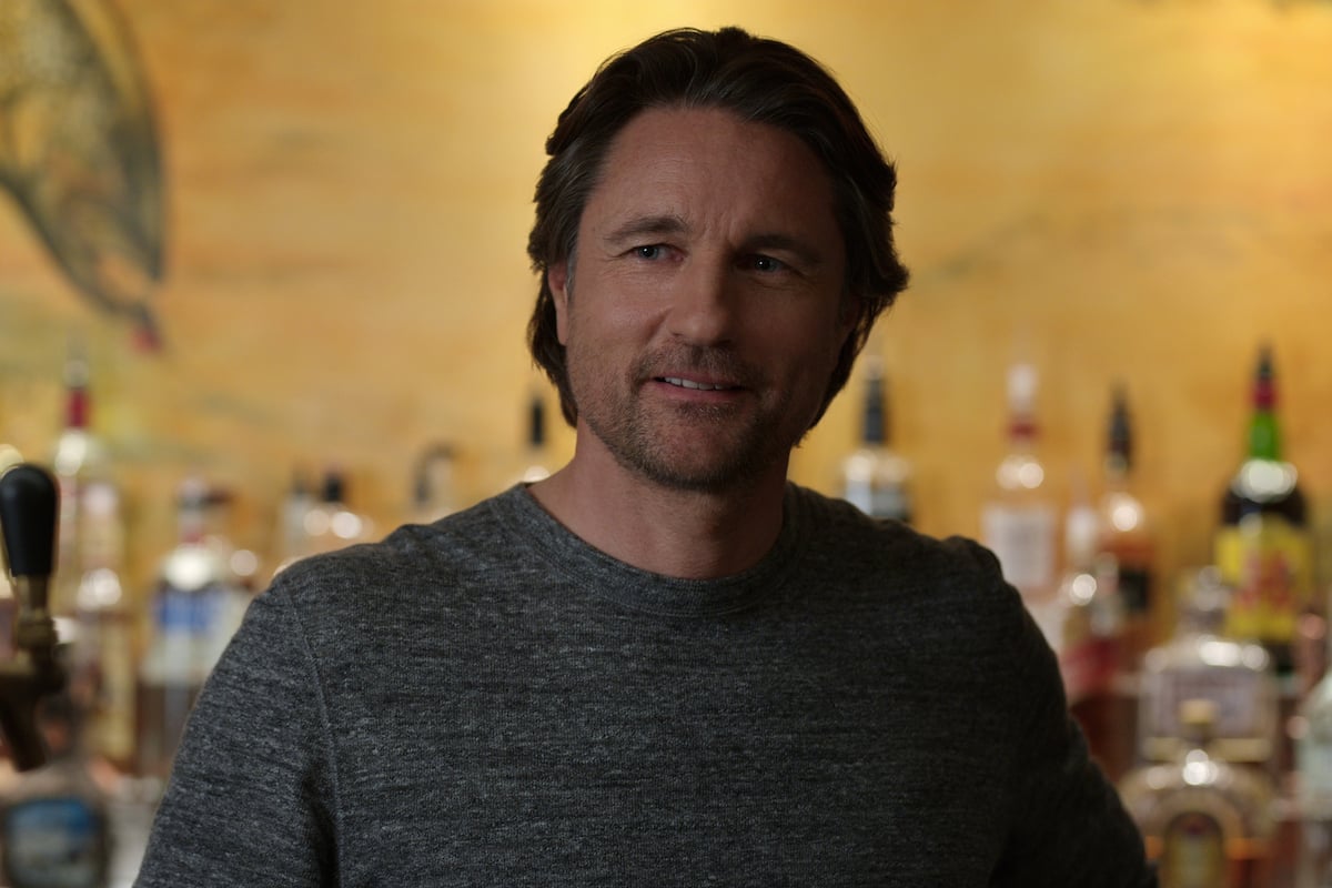 Martin Henderson as Jack Sheridan wearing a grey shirt in 'Virgin River'