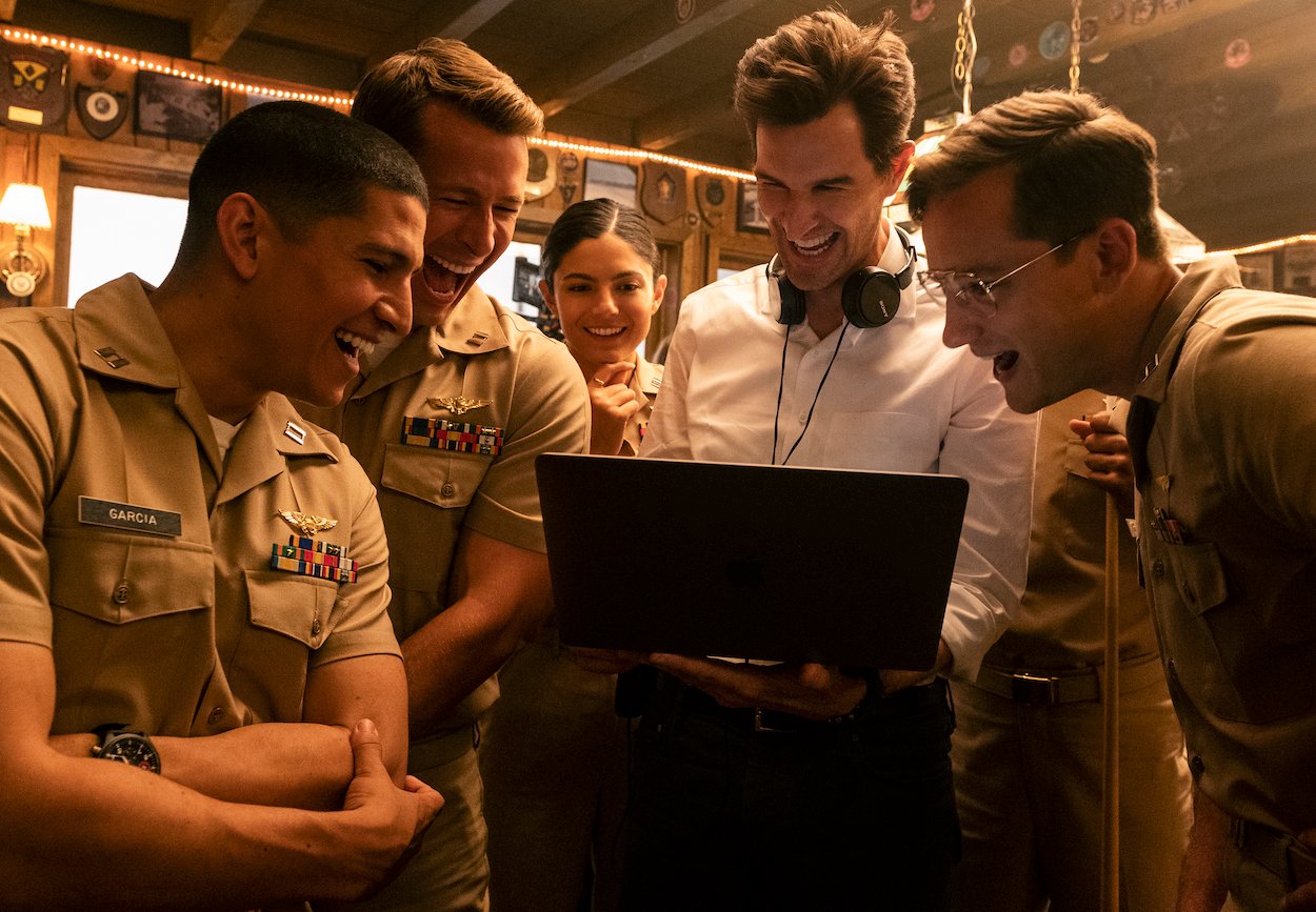 'Top Gun: Maverick" director Joseph Kosinski (second from right) on set with Danny Ramirez, Glen Powell, Monica Barbaro, and Lewis Pullman. Kosinski chose to leave a flaw in the movie because he thought it was cool.