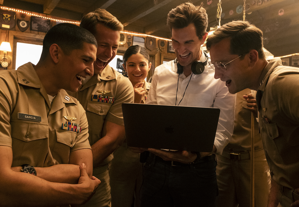 'Top Gun: Maverick" director Joseph Kosinski (second from right) on set with Danny Ramirez, Glen Powell, Monica Barbaro, and Lewis Pullman. Kosinski chose to leave a flaw in the movie because he thought it was cool.