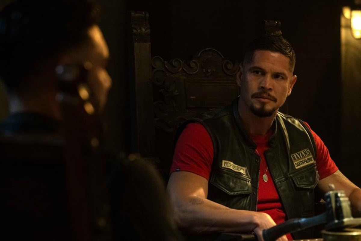 JD Pardo as EZ Reyes in the Mayans MC Season 4 finale. EZ looks at his brother from across the table. 