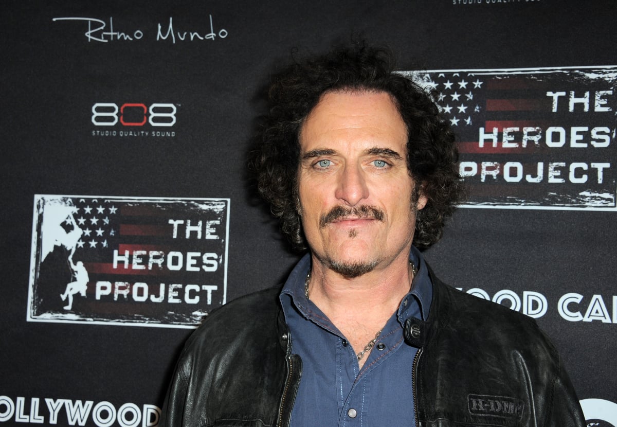 Kim Coates will appear in the Mayans MC Season 4 finale. Coates wears a blue shirt and black leather jacket. 