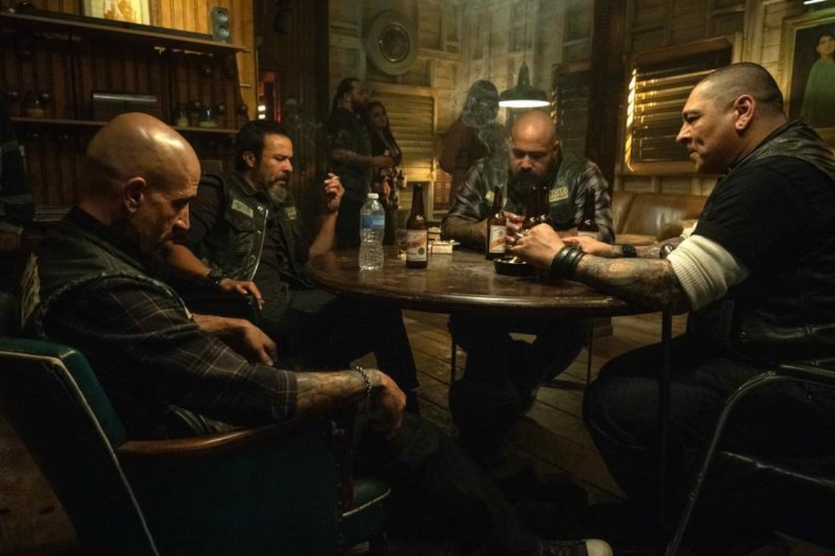 What will happen in Mayans MC Season 5. Creeper, Bishop, Gilly, and Hank sit around a table at the Santo Padre clubhouse. 
