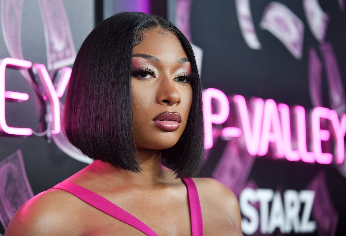 Megan Thee Stallion attends the premiere of STARZ season 2 of "P-Valley" wearing pink and a black bob