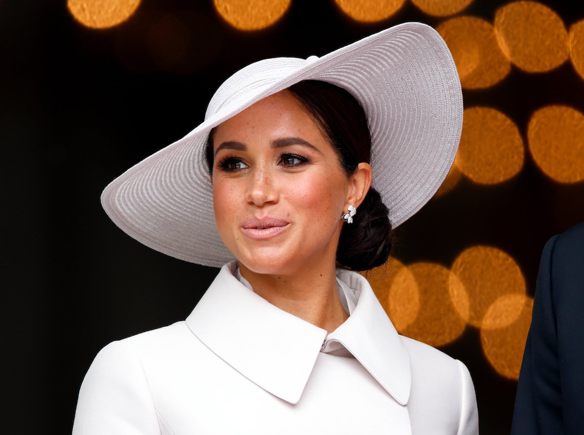 Meghan Markle, who was accused of bullying, looks on