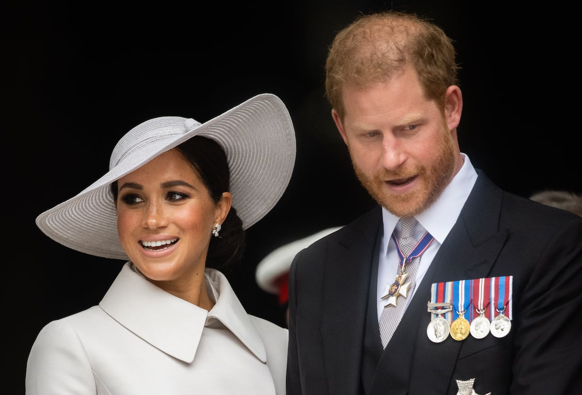 Meghan Markle and Prince Harry, who left Platinum Jubilee weekend early before the Platinum Jubilee pageant, look on outside St. Paul's Cathedral