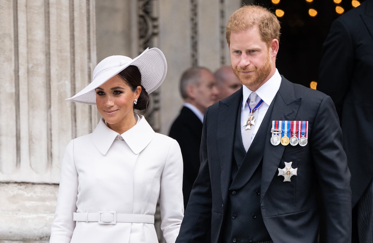 Meghan Markle and Prince Harry, who Mike Tindall reportedly called a "b*****d," walk down the steps of St. Paul's Cathedral during Platinum Jubilee weekend