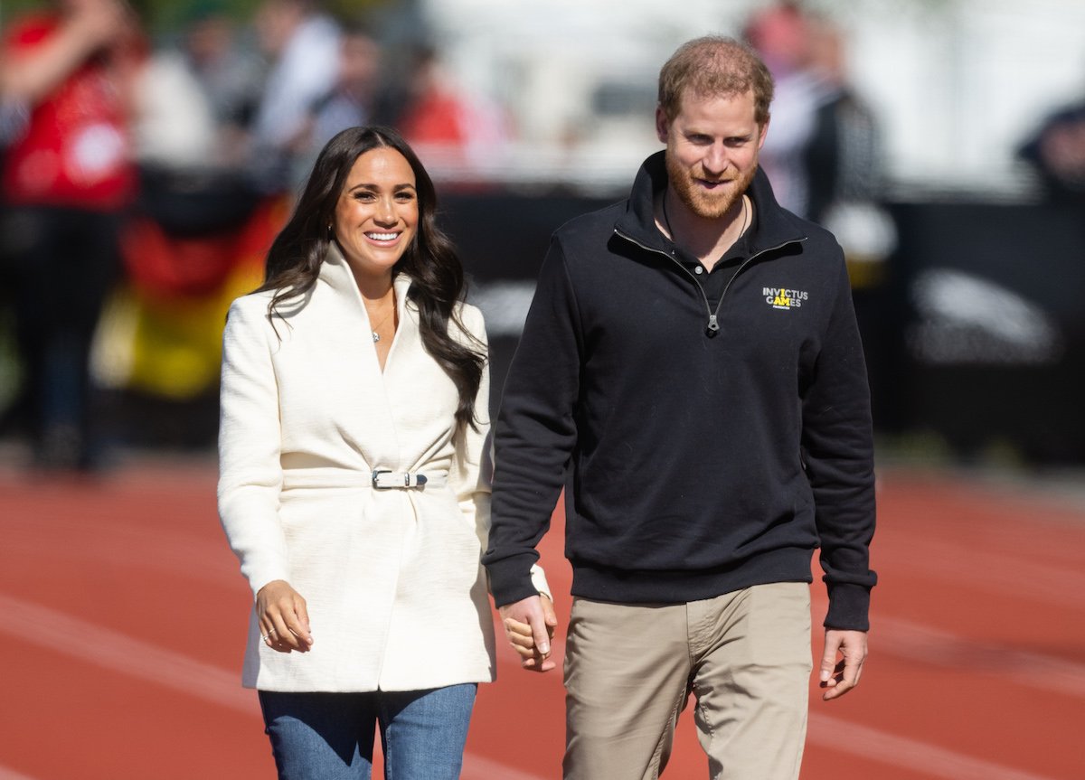 Meghan Markle and Prince Harry, who visited Oprah's home, walk together during a 2020 Invictus Games event