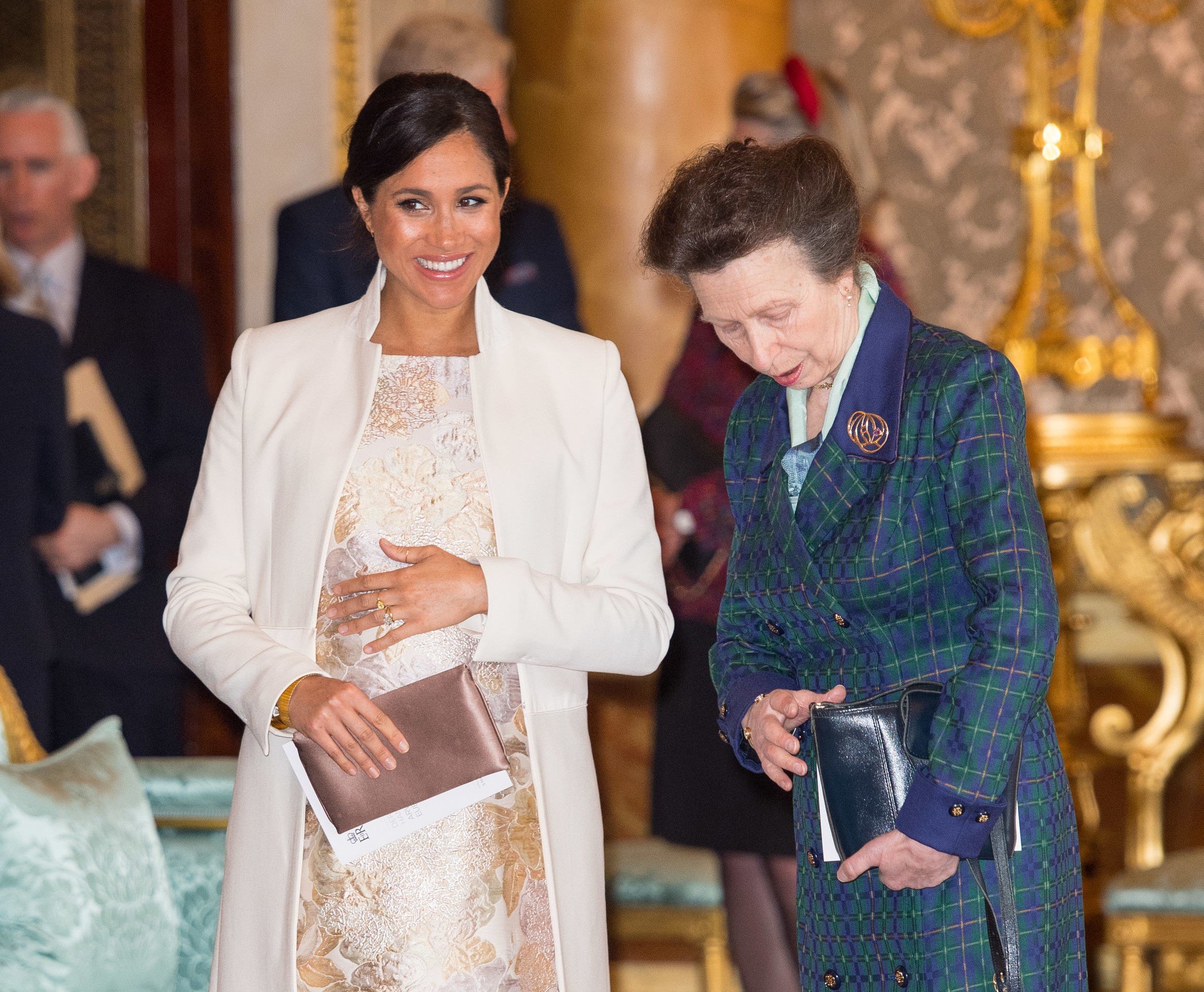 Meghan Markle and Princess Anne standing next to each other during a reception at Buckingham Palace