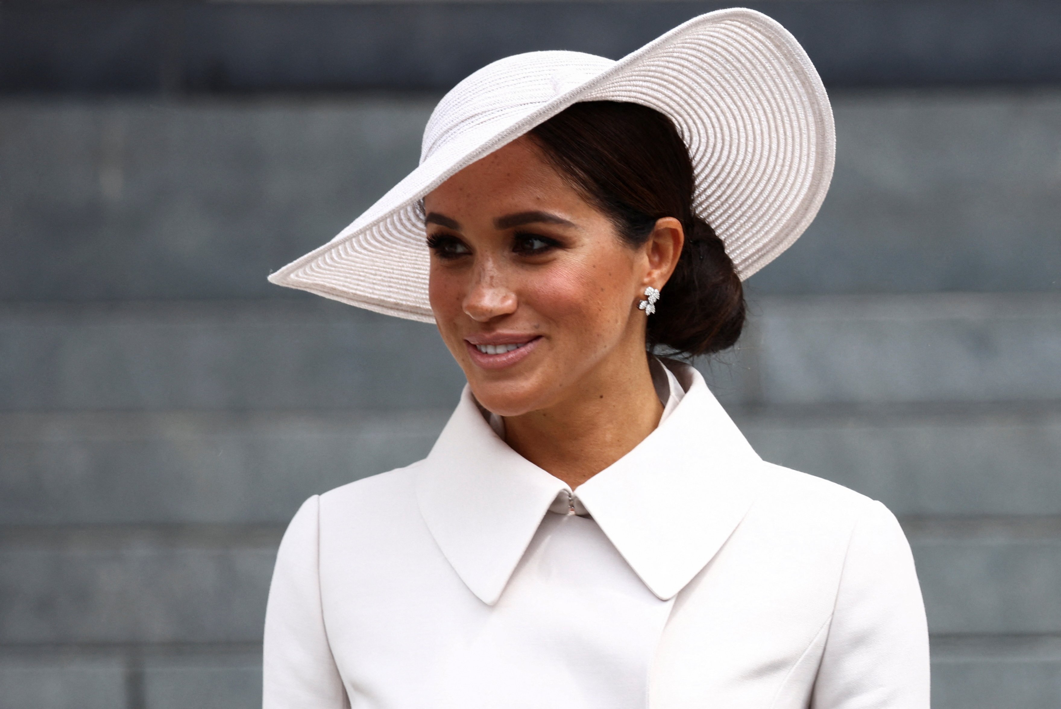 Meghan Markle, whose body language was analyzed during first appearance with the royal family, attends the National Service of Thanksgiving to Celebrate Queen Elizabeth II's Platinum Jubilee