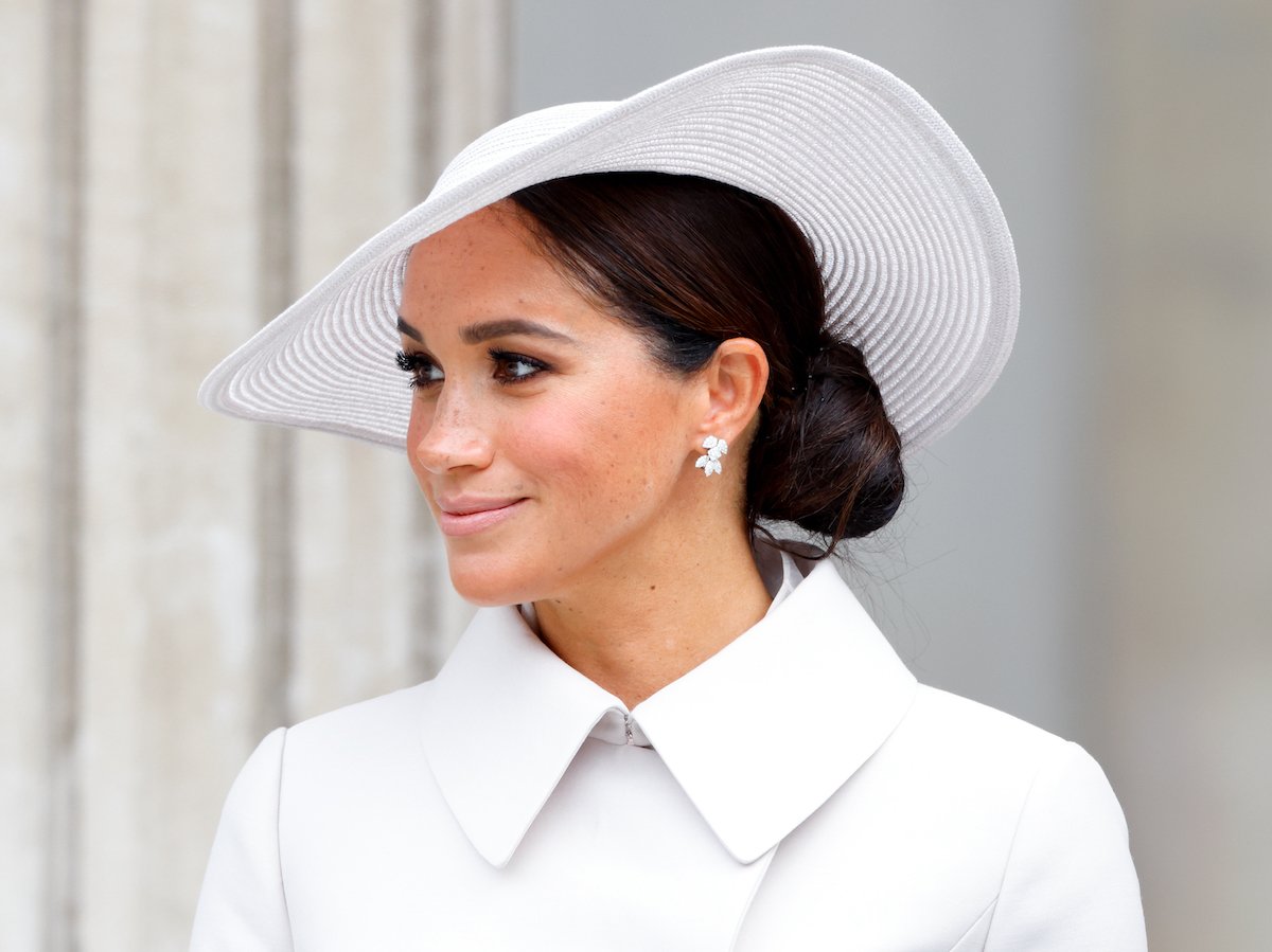 Meghan Markle, who is friends with Gloria Steinem, looks on