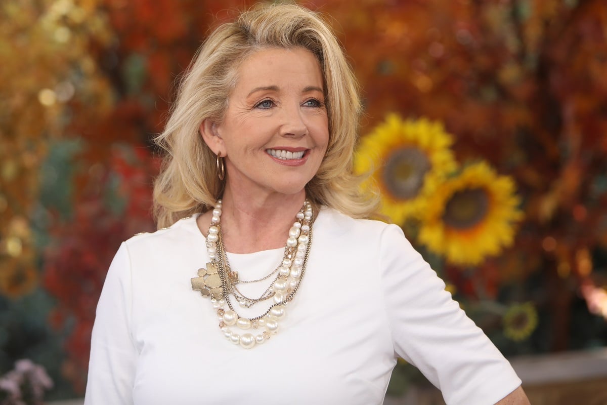 'The Young and the Restless' star Melody Thomas Scott wearing a white dress during a TV appearance.