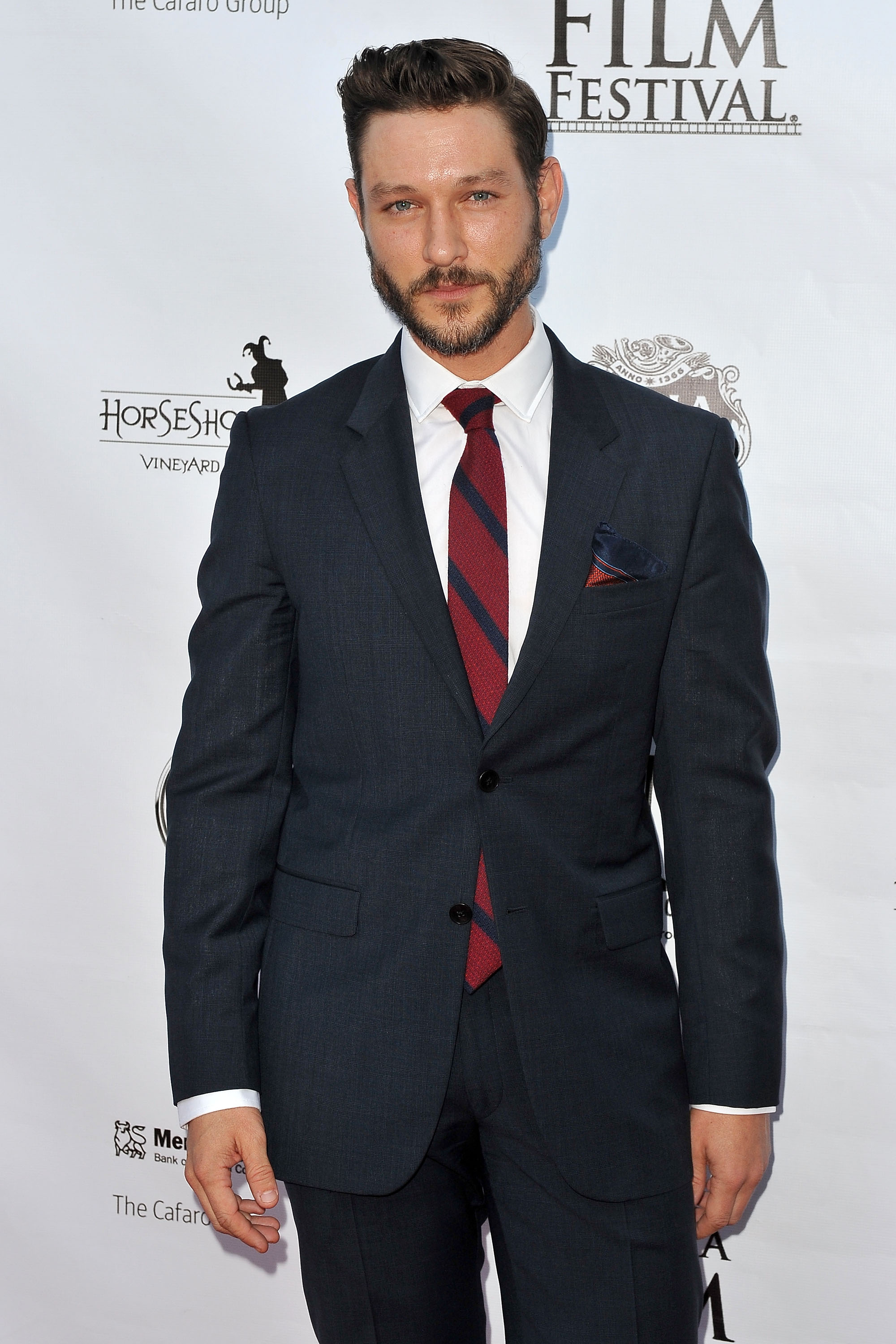 'The Young and the Restless' actor Michael Graziadei dressed in a navy blue suit.