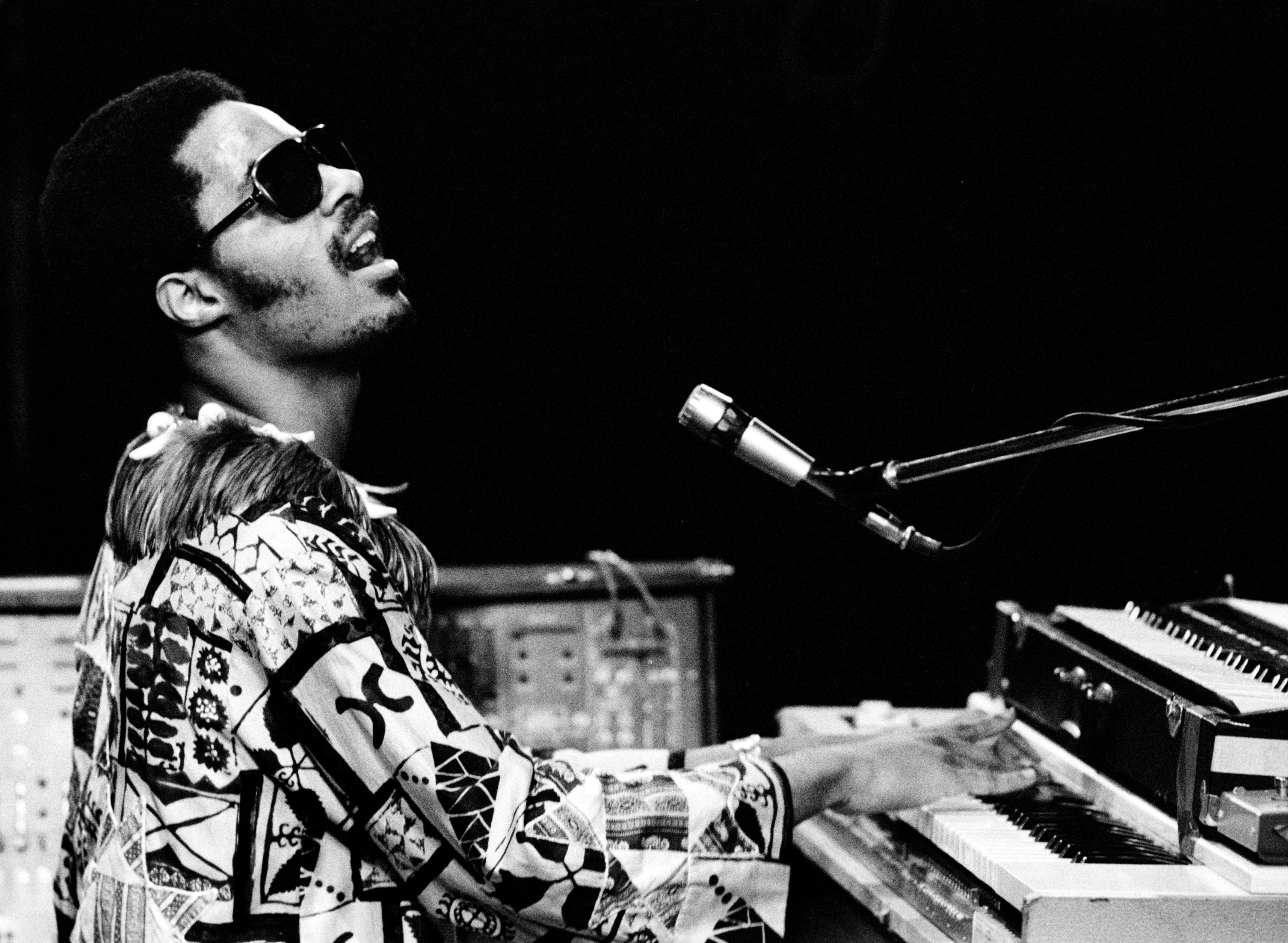Stevie Wonder with a piano