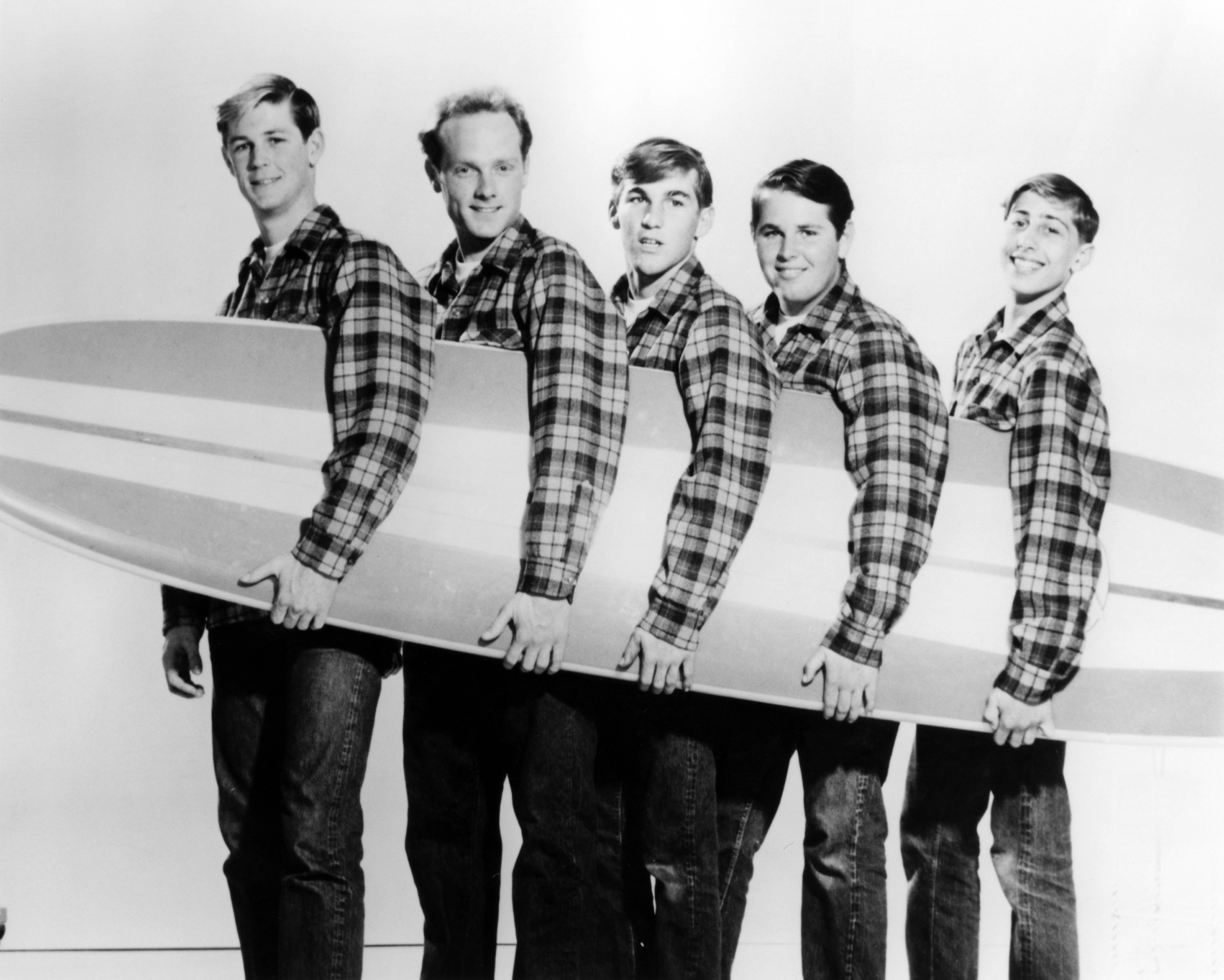 The Beach Boys with a surf board