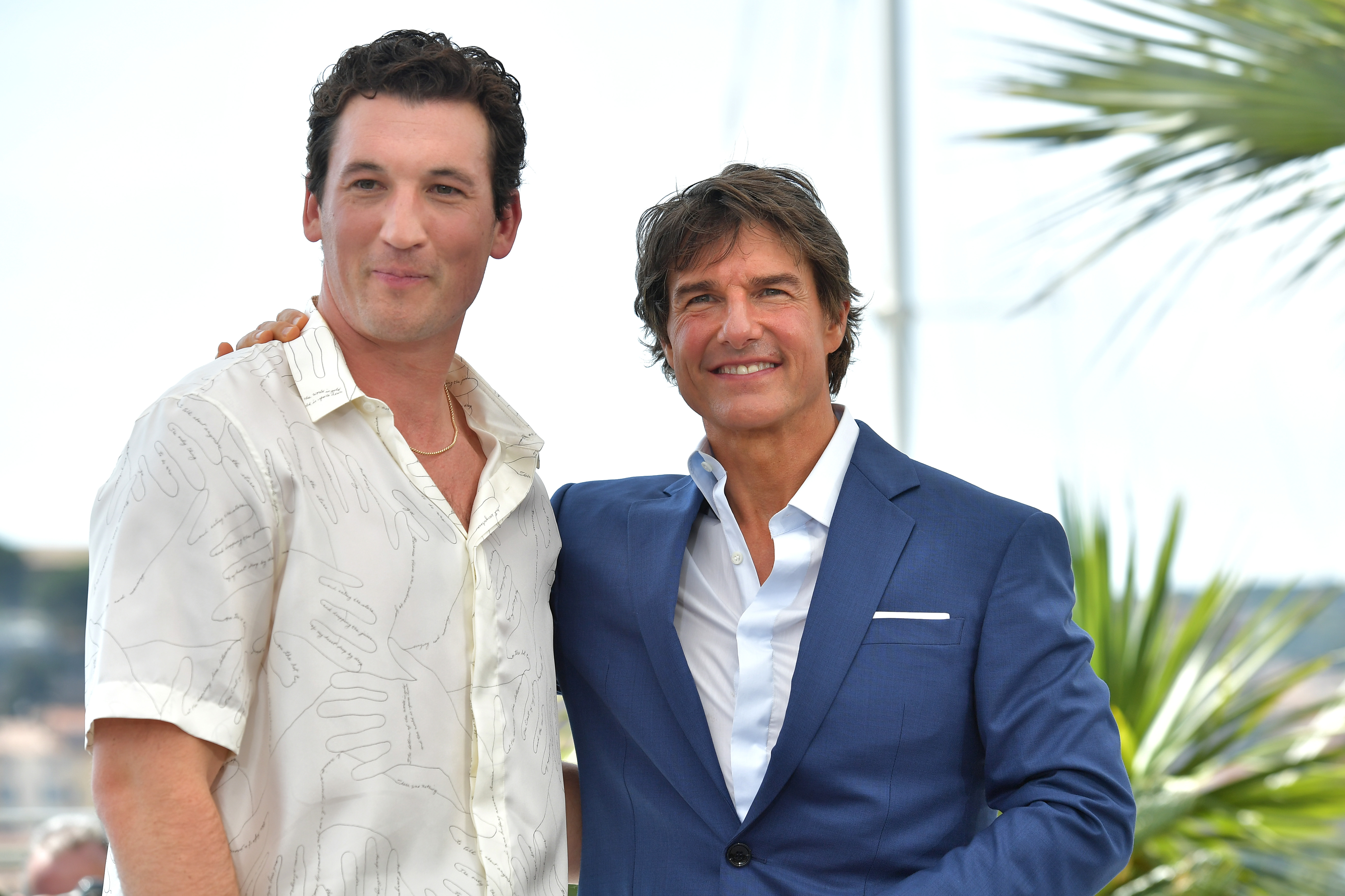 Miles Teller and Tom Cruise attend the photocall for Top Gun: Maverick at the 75th annual Cannes film festival
