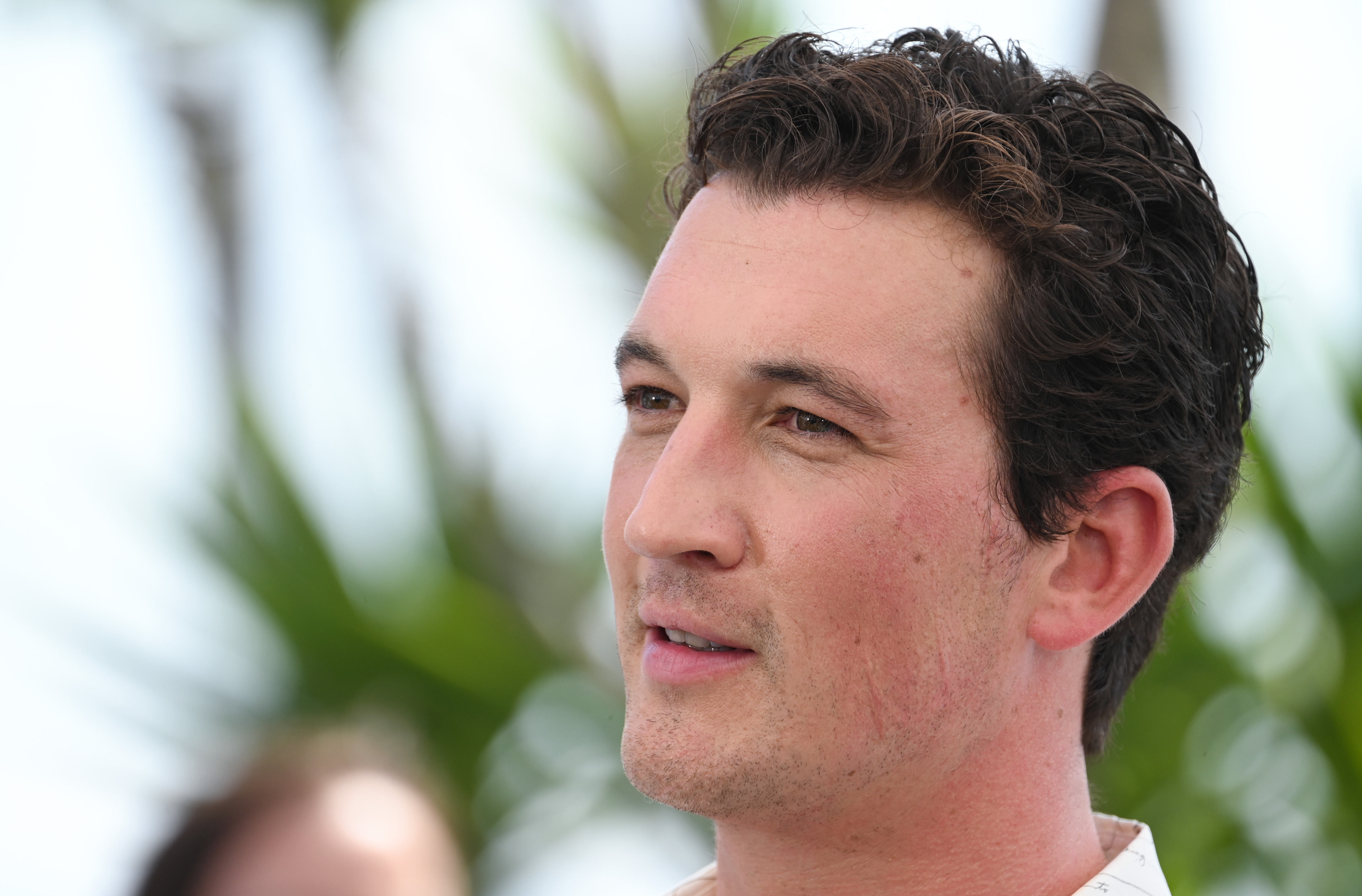 Miles Teller attends the photocall for Top Gun: Maverick at the 75th annual Cannes film festival