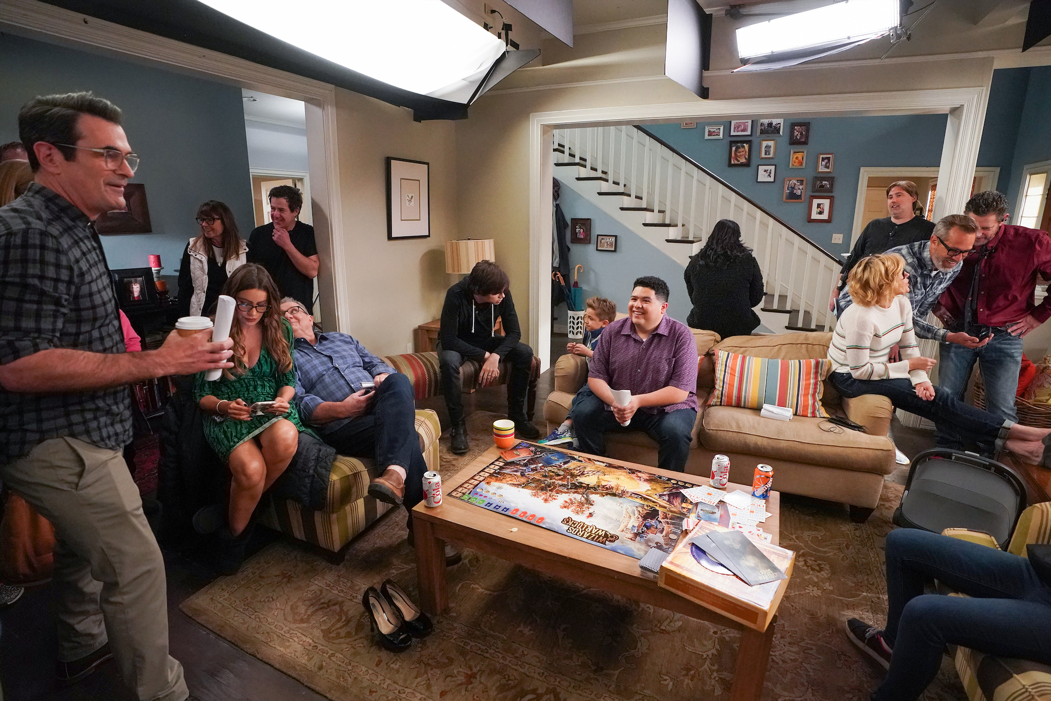 ABC's 'Modern Family' cast sitting in a living room to film the finale