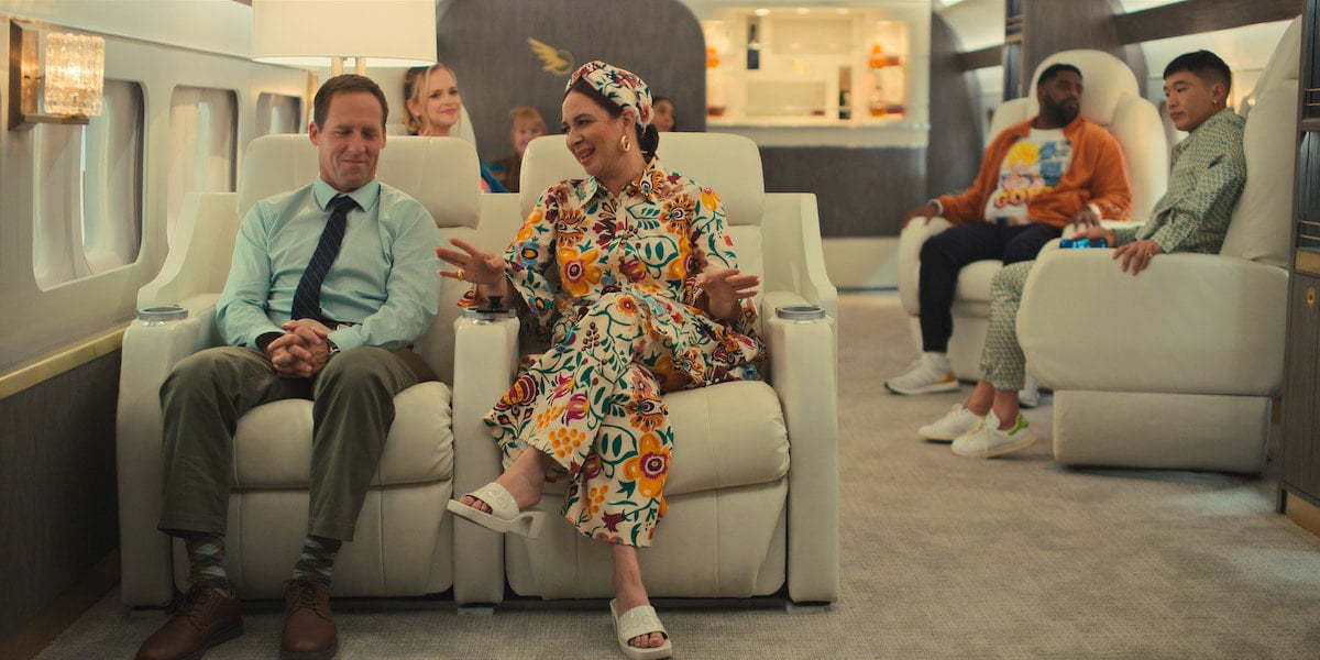 Nat Faxon and Maya Rudolph sit next to each other in 'Loot' Season 1 Episode 3: 'Bienvenidos a Miami'