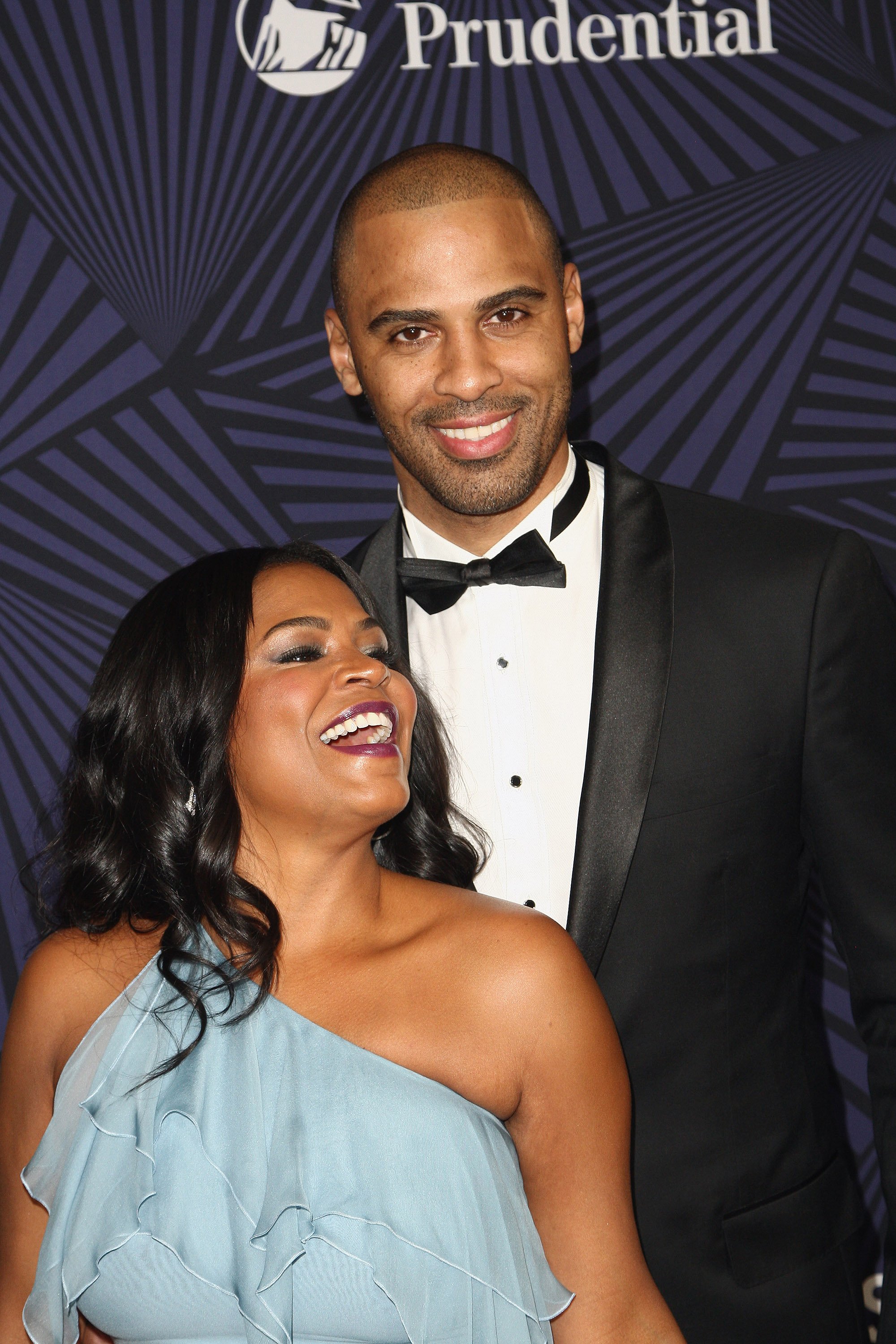 Nia Long and Ime Udoka smiling on the carpet at BET's American Black Film Festival