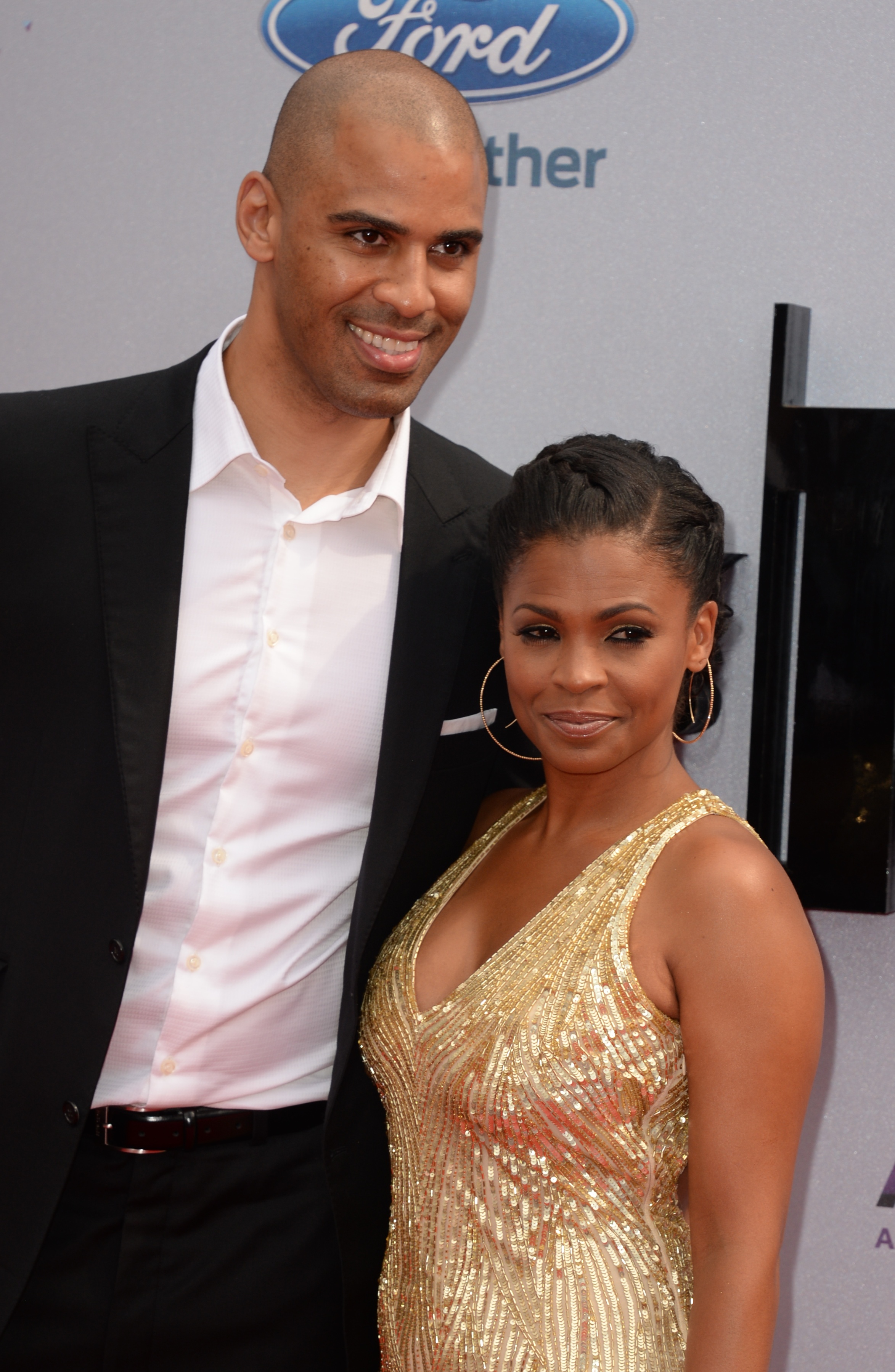Nia Long, who is older than Ime Udoka, posing together on the red carpet at BET Awards