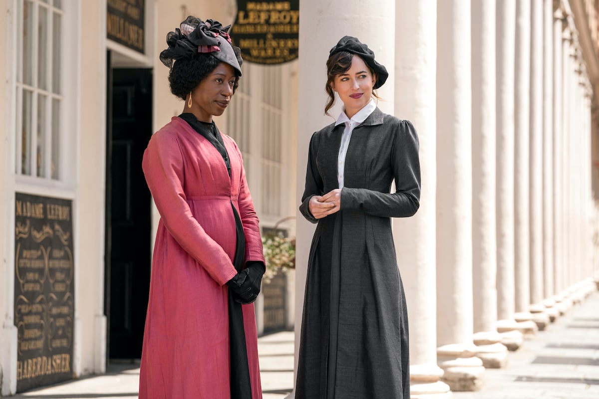 Nikki Amuk-Bird in pink and Dakota Johnson in gray in the Netflix movie 'Persuasion'